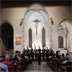 2015 - Il Coro Acad&eacute;mico da Universidade do Minho durante l&rsquo;esibizione nel Duomo del SS. Corpo di Cristo a Valvasone, diretto da Rui Paulo Teixeira.